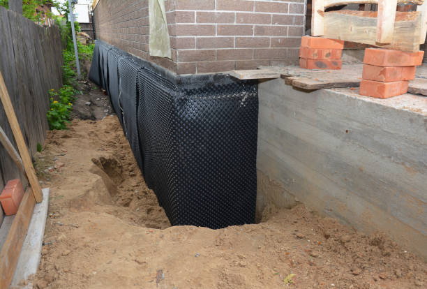 Happy homeowners after waterproofing job in Suitland